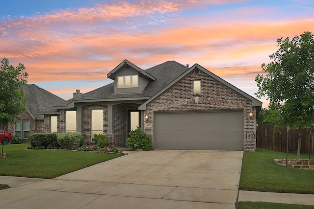 1512 Nighthawk Ln, Mansfield, TX 76063 - view of front facade with brick siding, driveway, an attached garage, and a shingled roof