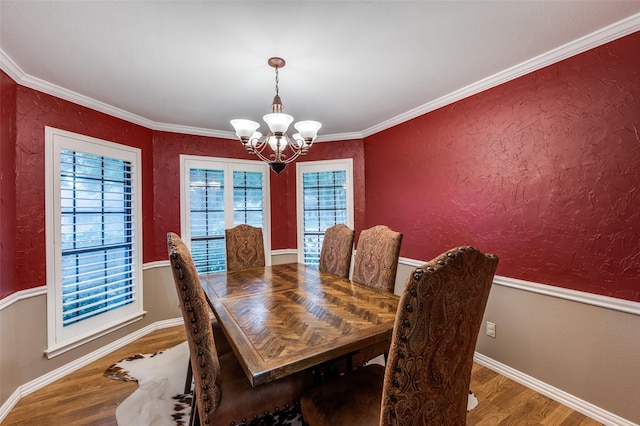 2401 Kingston Trce, Denton, TX 76209 - dining space featuring a chandelier, wood finished floors, baseboards, and ornamental molding