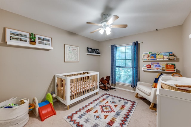 2401 Kingston Trce, Denton, TX 76209 - bedroom with carpet floors, a crib, and a ceiling fan