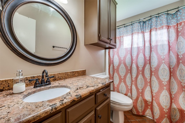 2401 Kingston Trce, Denton, TX 76209 - full bath with vanity, toilet, tile patterned floors, and a shower with shower curtain