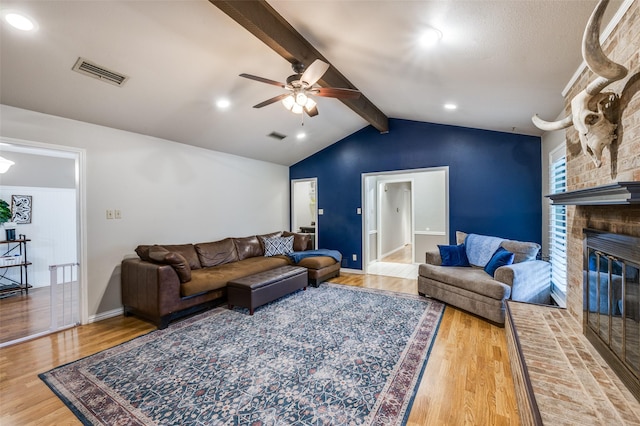 2401 Kingston Trce, Denton, TX 76209 - living area with a ceiling fan, wood finished floors, a brick fireplace, and baseboards