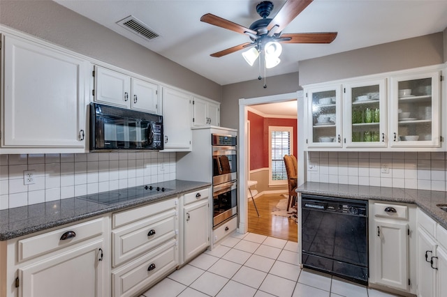 2401 Kingston Trce, Denton, TX 76209 - kitchen with black appliances, ceiling fan, glass insert cabinets, and white cabinets