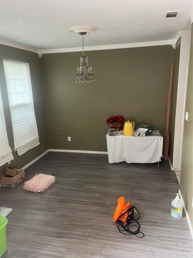 2225 W Appaloosa Dr, Lancaster, TX 75146 - unfurnished dining area featuring ornamental molding, a chandelier, wood finished floors, and baseboards