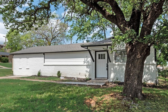 4901 Wilmington Dr, Fort Worth, TX 76107 - ranch-style house with brick siding, a front lawn, and a shingled roof