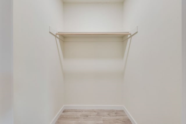 4901 Wilmington Dr, Fort Worth, TX 76107 - walk in closet with light wood-type flooring
