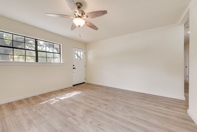 4901 Wilmington Dr, Fort Worth, TX 76107 - foyer featuring a ceiling fan, wood finished floors, and baseboards