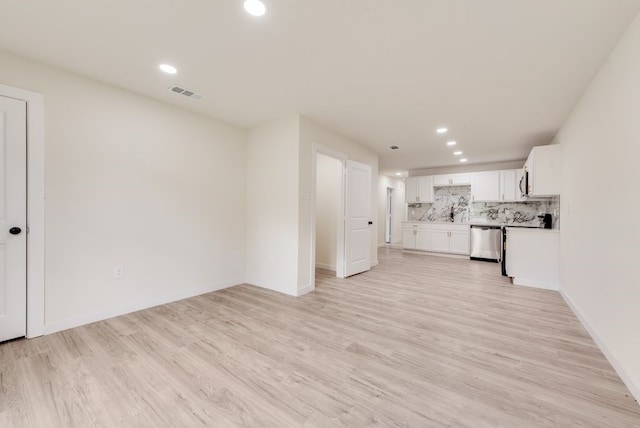 4901 Wilmington Dr, Fort Worth, TX 76107 - unfurnished living room featuring recessed lighting, light wood finished floors, and baseboards