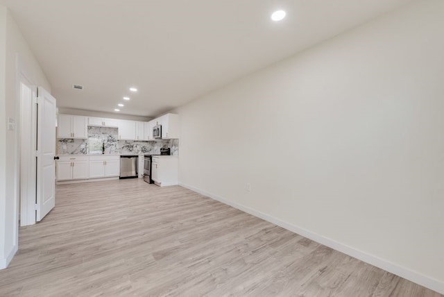 4901 Wilmington Dr, Fort Worth, TX 76107 - unfurnished living room with recessed lighting, light wood finished floors, and baseboards