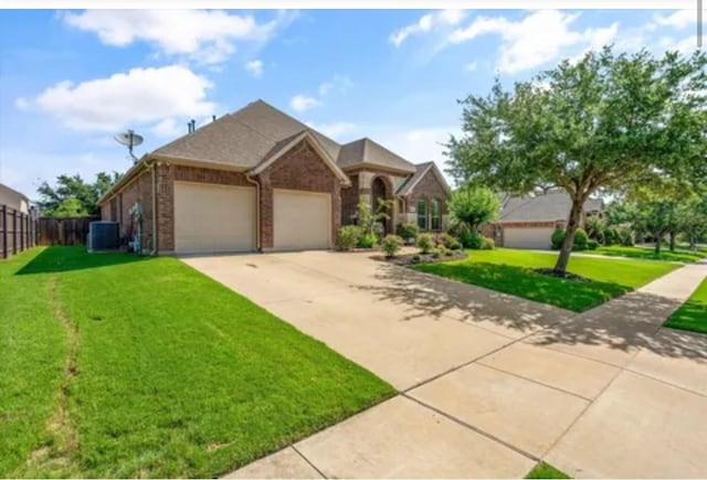 1104 Killian Dr, Mansfield, TX 76063 - view of front of home featuring central air condition unit, an attached garage, concrete driveway, and brick siding