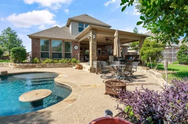 1104 Killian Dr, Mansfield, TX 76063 - view of swimming pool with a fire pit and a patio area