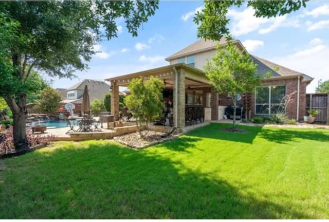 1104 Killian Dr, Mansfield, TX 76063 - rear view of property with a patio and an outdoor pool