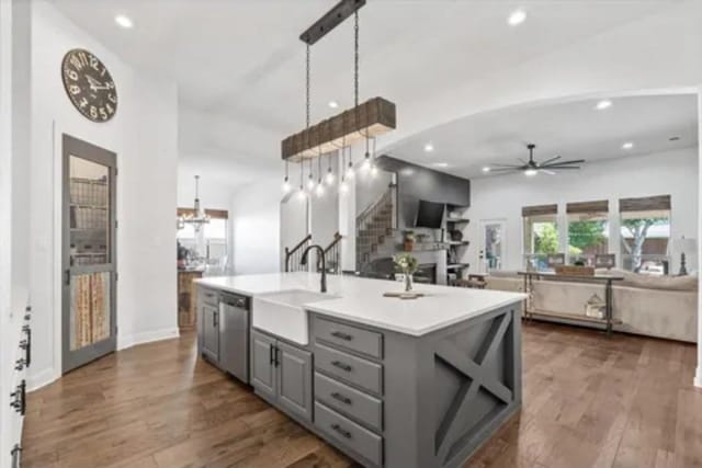 1104 Killian Dr, Mansfield, TX 76063 - kitchen featuring gray cabinetry, a sink, stainless steel dishwasher, a ceiling fan, and dark wood finished floors