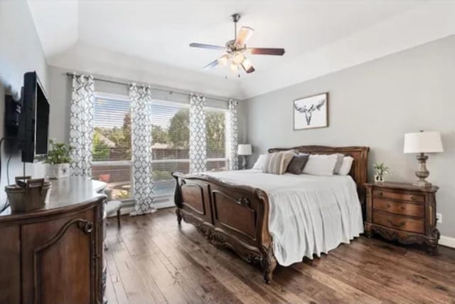 1104 Killian Dr, Mansfield, TX 76063 - bedroom with dark wood-style flooring, a ceiling fan, and a raised ceiling