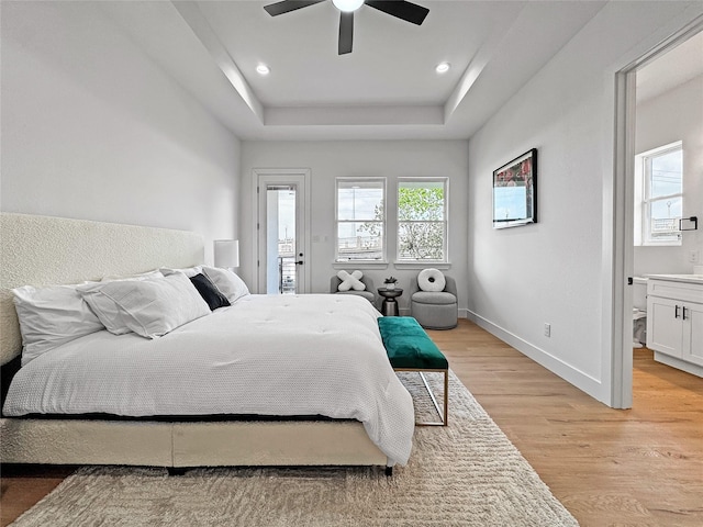 2417 Merlin St, Dallas, TX 75215 - bedroom with light wood finished floors, baseboards, a raised ceiling, a ceiling fan, and recessed lighting