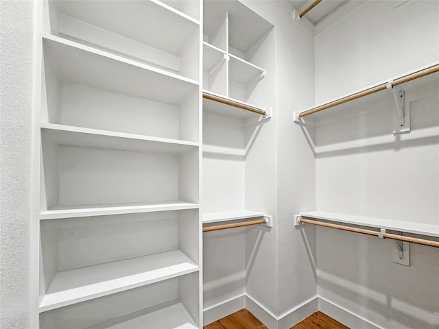 2417 Merlin St, Dallas, TX 75215 - spacious closet featuring wood finished floors