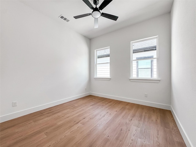 2417 Merlin St, Dallas, TX 75215 - unfurnished room with light wood-style flooring, baseboards, and a ceiling fan