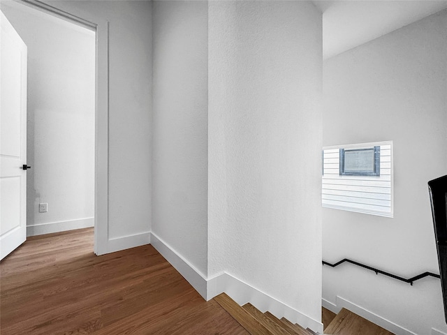 2417 Merlin St, Dallas, TX 75215 - corridor featuring wood finished floors and baseboards
