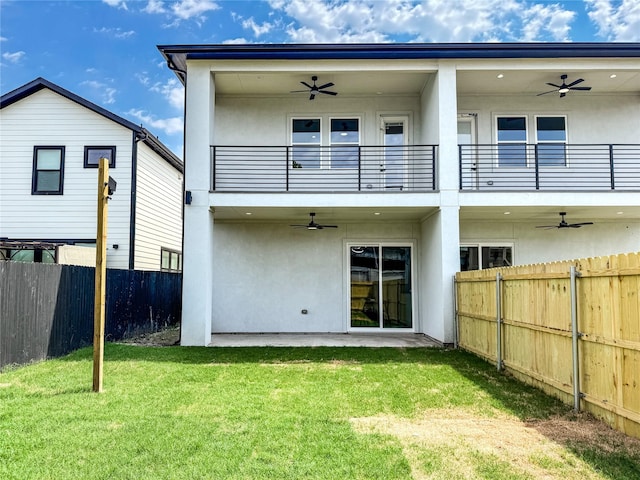 2417 Merlin St, Dallas, TX 75215 - back of property featuring a ceiling fan, a balcony, and stucco siding