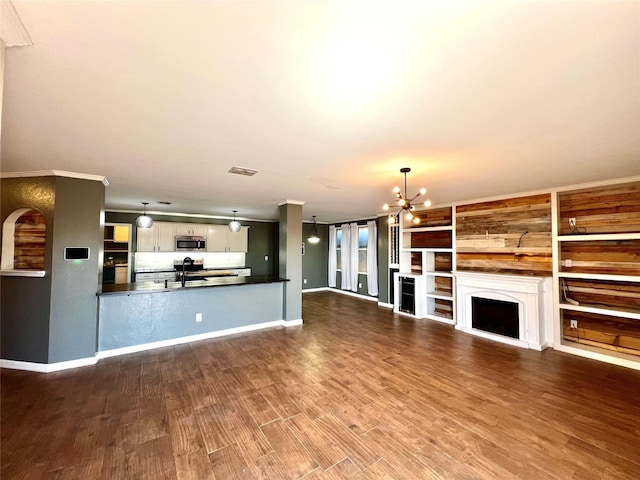 608 Marbury Way, Wylie, TX 75098 - unfurnished living room with a chandelier, dark wood-style flooring, a sink, and baseboards