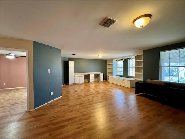 608 Marbury Way, Wylie, TX 75098 - unfurnished living room featuring wood finished floors, baseboards, and built in features
