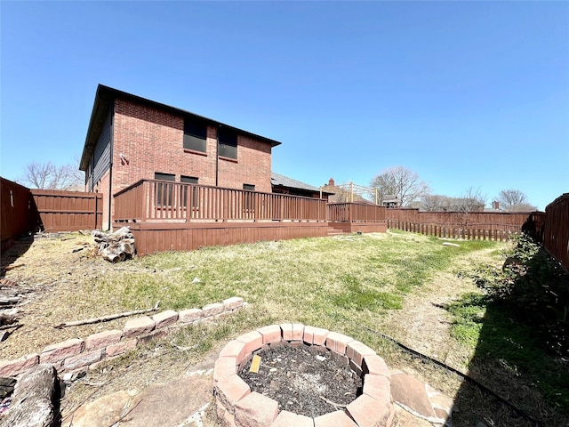 608 Marbury Way, Wylie, TX 75098 - rear view of property featuring an outdoor fire pit, brick siding, and a deck