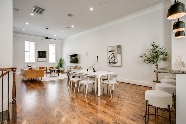 2123 Diversey St, Dallas, TX 75201 - dining room featuring ornamental molding, recessed lighting, baseboards, wood finished floors, and ceiling fan