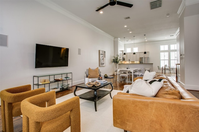 2123 Diversey St, Dallas, TX 75201 - living area featuring a ceiling fan, baseboards, ornamental molding, recessed lighting, and light wood-style flooring