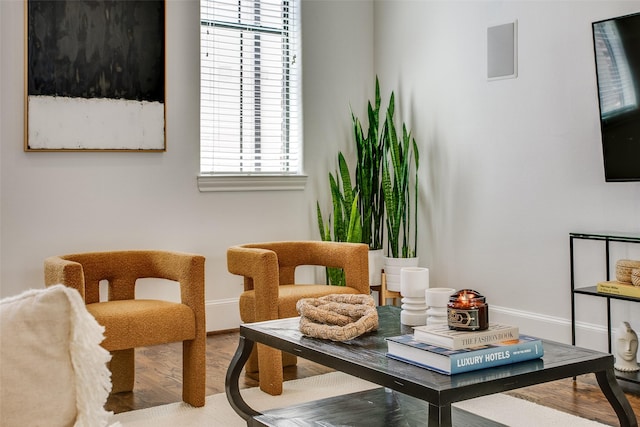 2123 Diversey St, Dallas, TX 75201 - sitting room with baseboards and wood finished floors