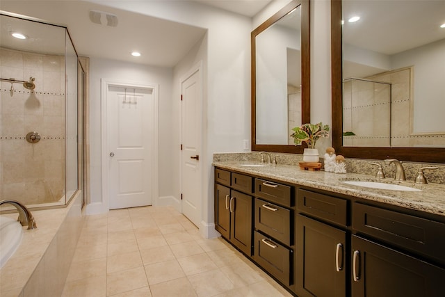 2123 Diversey St, Dallas, TX 75201 - full bathroom featuring double vanity, a tile shower, tile patterned floors, recessed lighting, and a relaxing tiled tub