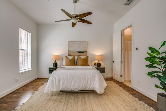 2123 Diversey St, Dallas, TX 75201 - bedroom with wood finished floors, baseboards, and a ceiling fan