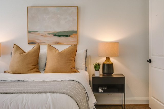 2123 Diversey St, Dallas, TX 75201 - bedroom with baseboards and wood finished floors