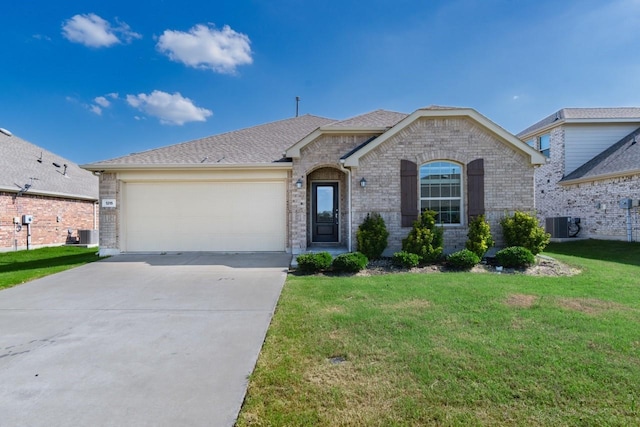 1215 Chapel Hill Dr, Anna, TX 75409 - french country inspired facade with driveway, central AC unit, an attached garage, brick siding, and a front lawn