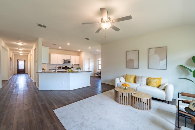 1215 Chapel Hill Dr, Anna, TX 75409 - living area with dark wood finished floors, a ceiling fan, baseboards, and recessed lighting