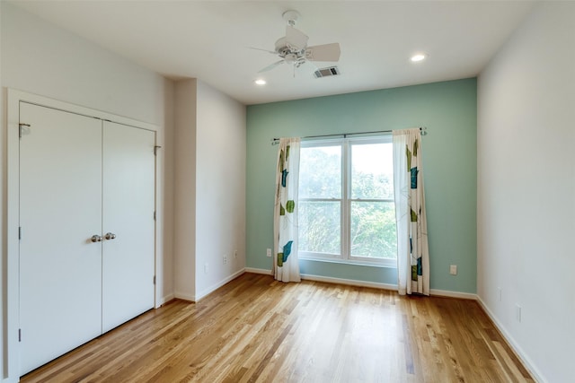 4100 Travis St Unit 19, Dallas, TX 75204 - unfurnished bedroom with light wood finished floors, baseboards, recessed lighting, a ceiling fan, and a closet