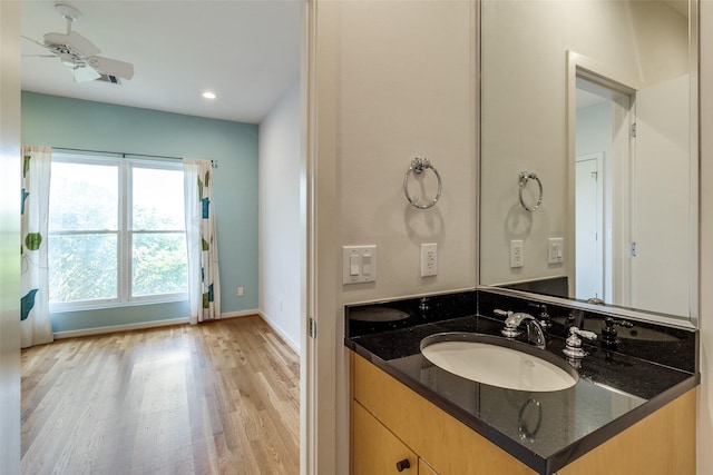 4100 Travis St Unit 19, Dallas, TX 75204 - bathroom with wood finished floors, vanity, baseboards, recessed lighting, and ceiling fan