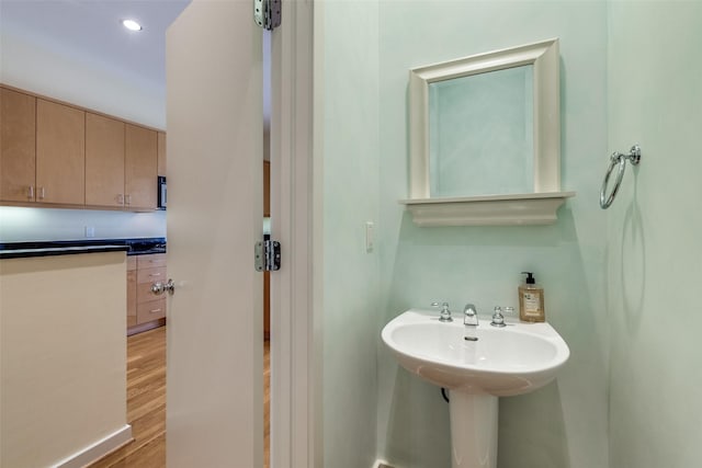 4100 Travis St Unit 19, Dallas, TX 75204 - bathroom with wood finished floors and recessed lighting