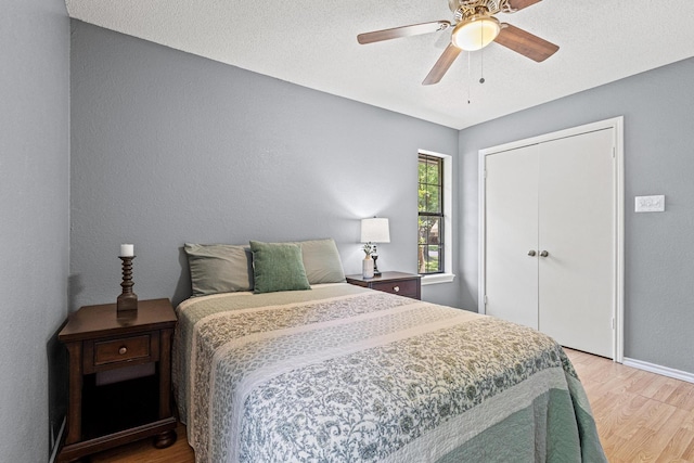 613 Locust St S, Sulphur Springs, TX 75482 - bedroom featuring light wood-type flooring, baseboards, a closet, and ceiling fan
