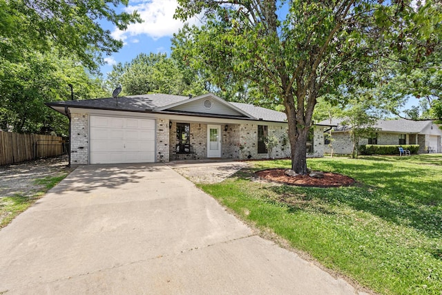613 Locust St S, Sulphur Springs, TX 75482 - ranch-style house with concrete driveway, brick siding, and a garage