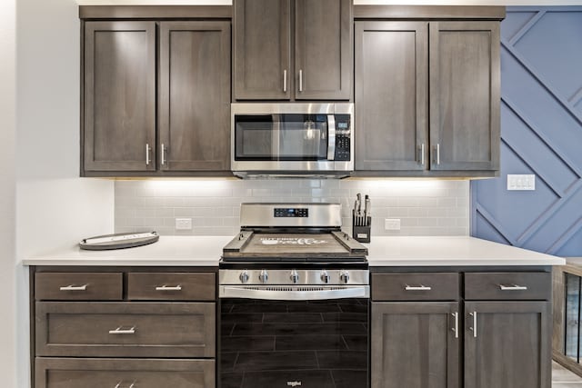 974 Mikaela Dr, Allen, TX 75013 - kitchen featuring appliances with stainless steel finishes, light countertops, decorative backsplash, and dark brown cabinets