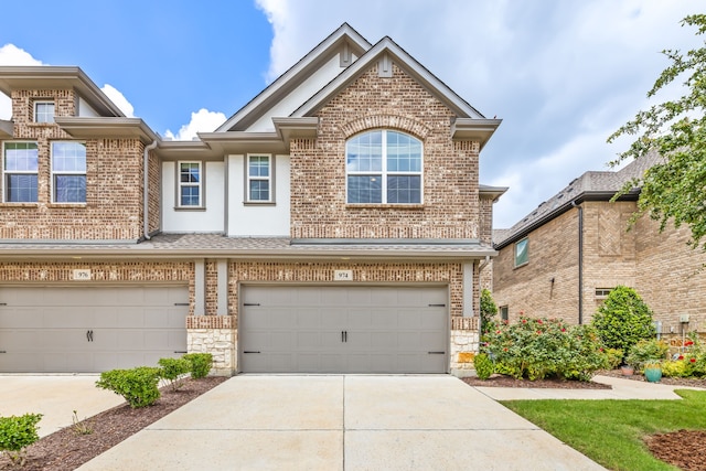 974 Mikaela Dr, Allen, TX 75013 - view of front facade featuring brick siding, driveway, and an attached garage