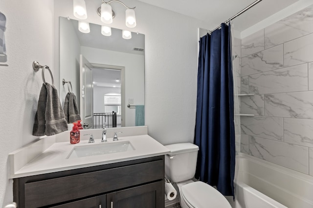 974 Mikaela Dr, Allen, TX 75013 - bathroom featuring vanity, toilet, shower / tub combo, and a textured wall
