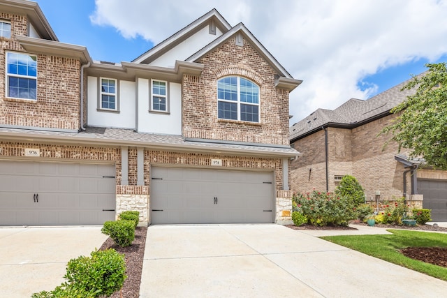 974 Mikaela Dr, Allen, TX 75013 - view of front of home featuring brick siding, driveway, an attached garage, and stucco siding