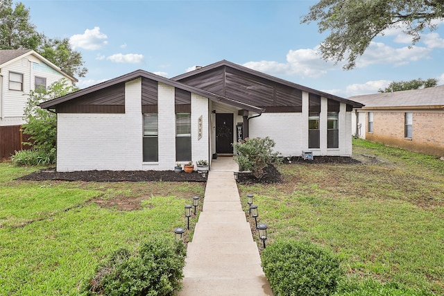 3713 Fairfield Dr, Carrollton, TX 75007 - mid-century inspired home with brick siding and a front lawn