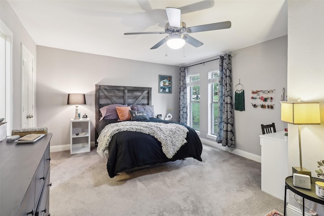 3713 Fairfield Dr, Carrollton, TX 75007 - bedroom featuring light colored carpet, baseboards, and ceiling fan