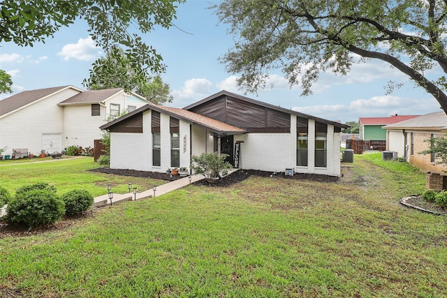 3713 Fairfield Dr, Carrollton, TX 75007 - rear view of house with central air condition unit and brick siding