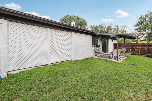 3713 Fairfield Dr, Carrollton, TX 75007 - back of house featuring a patio and brick siding