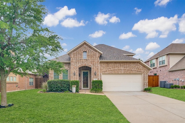 4301 Spruce Rd, Melissa, TX 75454 - view of front of property featuring brick siding, roof with shingles, an attached garage, concrete driveway, and central air condition unit