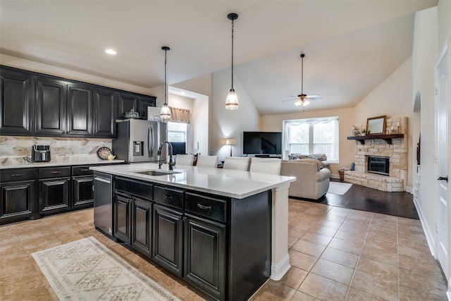 4301 Spruce Rd, Melissa, TX 75454 - kitchen featuring dark cabinetry, appliances with stainless steel finishes, a sink, high vaulted ceiling, and recessed lighting