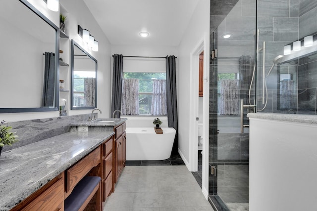 5 Remington Ct, Red Oak, TX 75154 - bathroom with vanity, a freestanding tub, a stall shower, toilet, and tile patterned floors