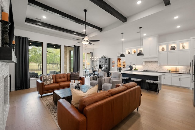 1804 Rockwood Ln, Mansfield, TX 76063 - living area featuring ceiling fan, light wood-style floors, beam ceiling, a brick fireplace, and recessed lighting